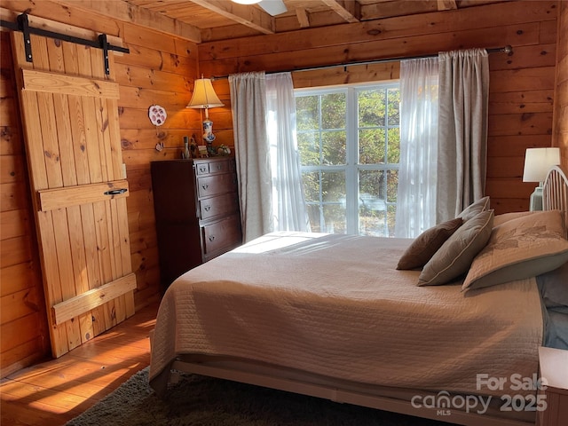 bedroom featuring hardwood / wood-style floors and ceiling fan