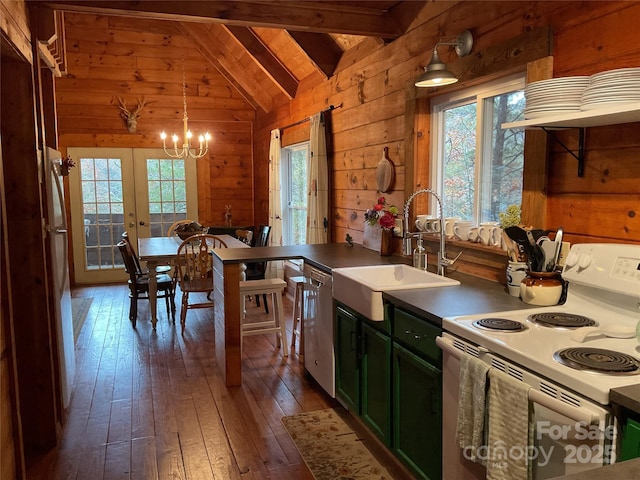 kitchen featuring electric stove, sink, wooden walls, lofted ceiling with beams, and decorative light fixtures