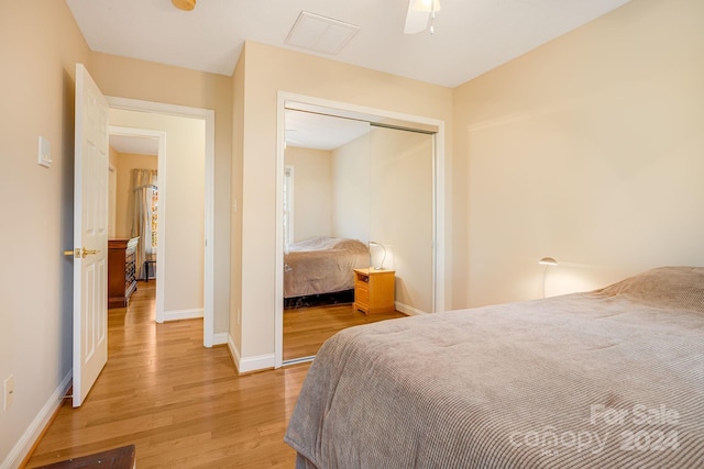 bedroom featuring a closet, ceiling fan, and hardwood / wood-style floors