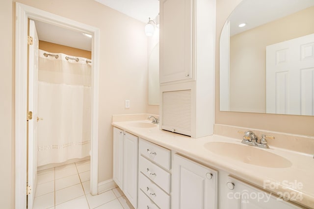 bathroom with tile patterned floors and vanity