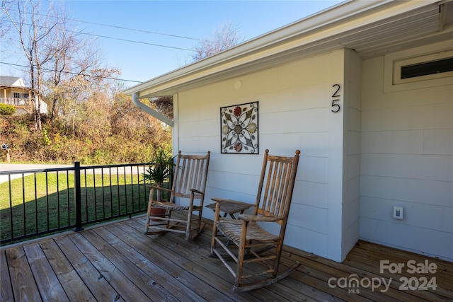 wooden deck with a yard