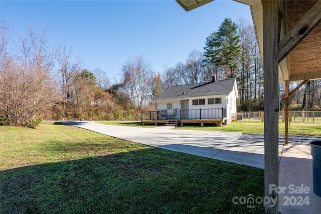 view of yard with a wooden deck