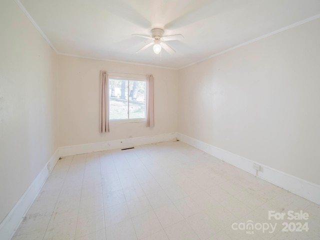 empty room with crown molding and ceiling fan