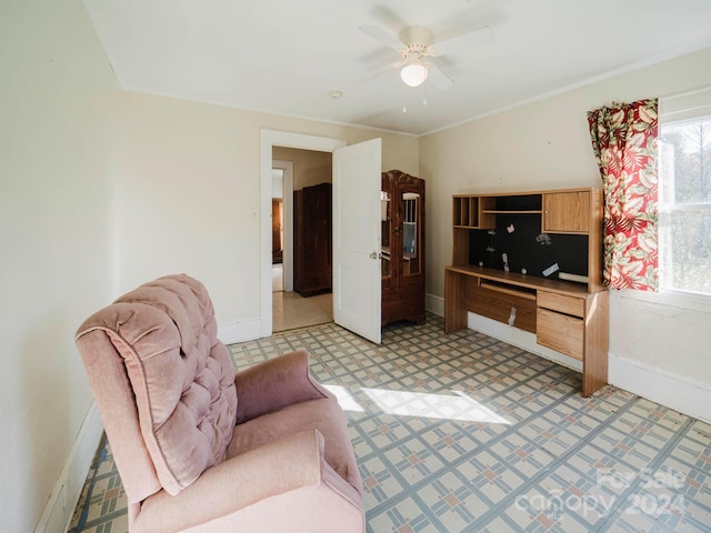 living room with ceiling fan and ornamental molding