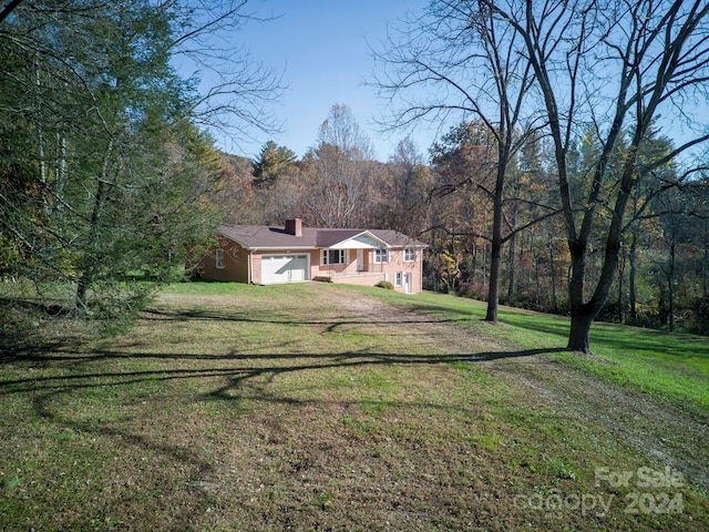 exterior space with a front yard and a garage