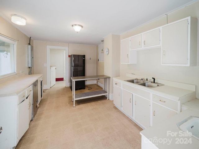 kitchen with dishwasher, sink, water heater, white cabinets, and black refrigerator