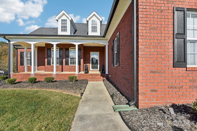 view of front of house with a front lawn and a porch