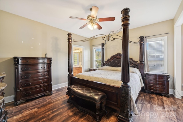 bedroom with ceiling fan, dark hardwood / wood-style floors, and ensuite bath