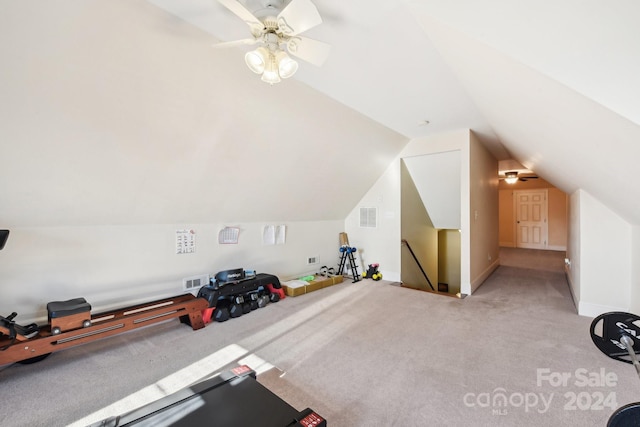 additional living space featuring light carpet, ceiling fan, and vaulted ceiling