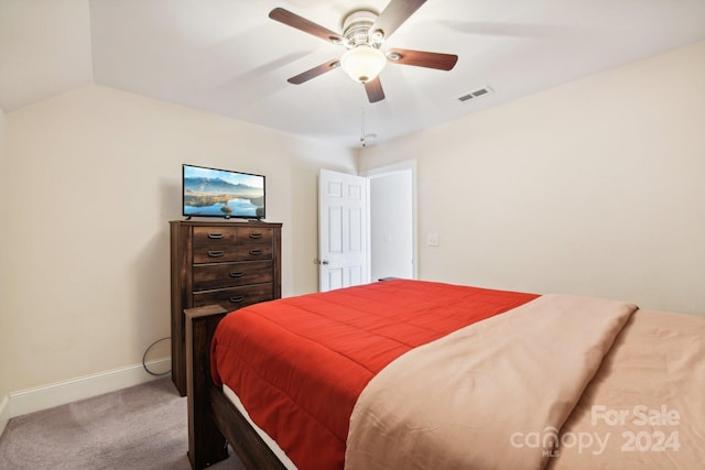 bedroom with carpet, vaulted ceiling, and ceiling fan