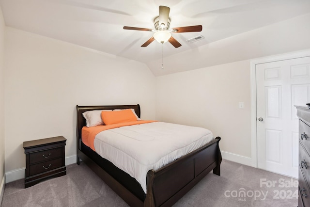 carpeted bedroom with ceiling fan and lofted ceiling