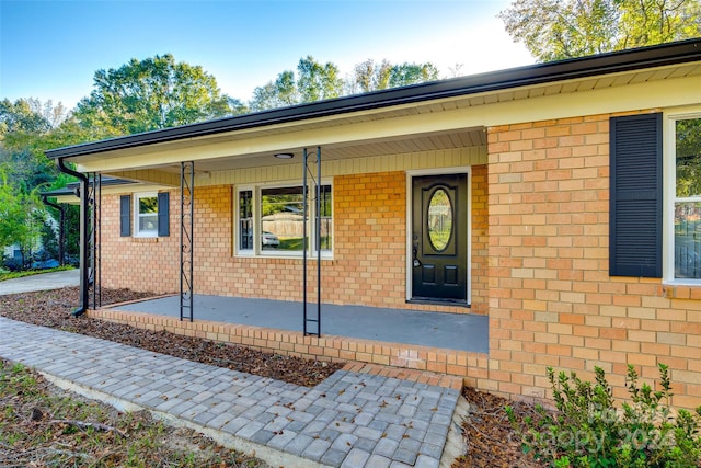 doorway to property with covered porch