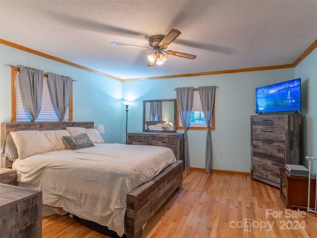 bedroom with ornamental molding, light hardwood / wood-style flooring, a textured ceiling, and ceiling fan