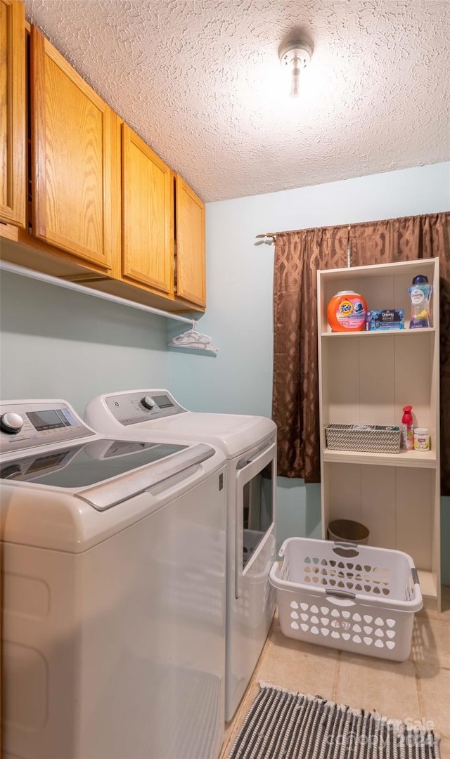 1000 Mountain View Church Rd, Zirconia, NC 28790 - washroom with cabinet space, separate washer and dryer, and a textured ceiling