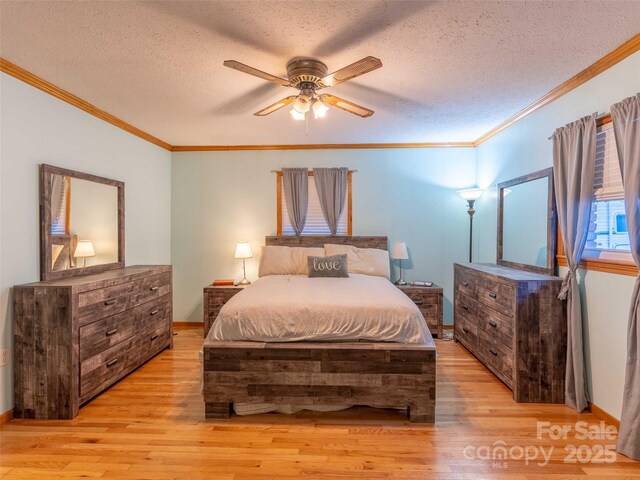 1000 Mountain View Church Rd, Zirconia, NC 28790 - bedroom with light wood-style floors, crown molding, a textured ceiling, baseboards, and ceiling fan