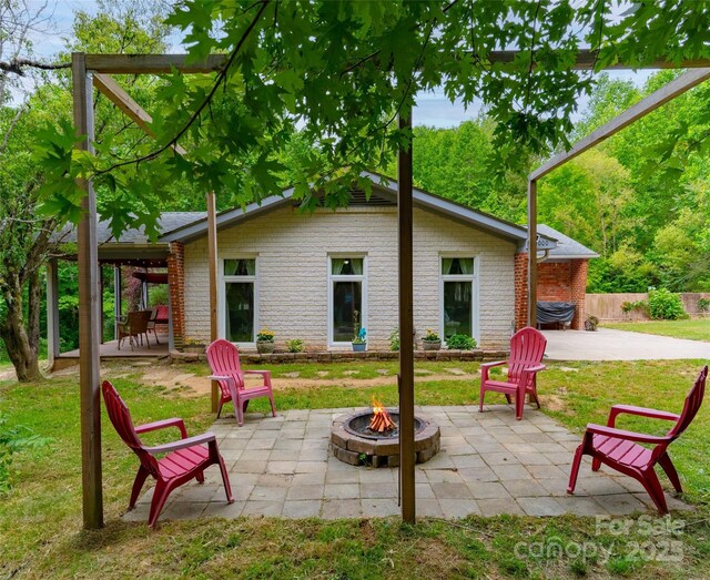 1000 Mountain View Church Rd, Zirconia, NC 28790 - view of patio / terrace featuring a fire pit