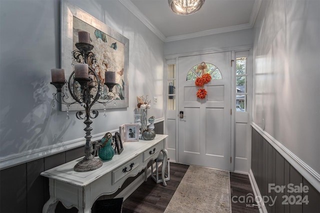 entrance foyer featuring crown molding and dark wood-type flooring