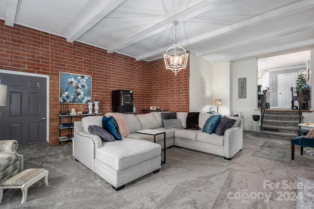 living room featuring an inviting chandelier, carpet flooring, beam ceiling, and brick wall