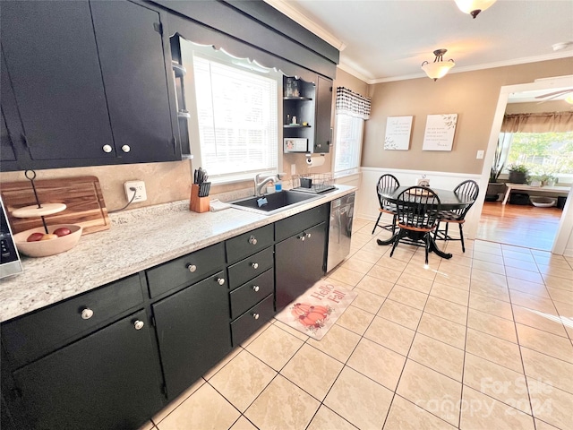 kitchen featuring stainless steel dishwasher, plenty of natural light, ornamental molding, and sink