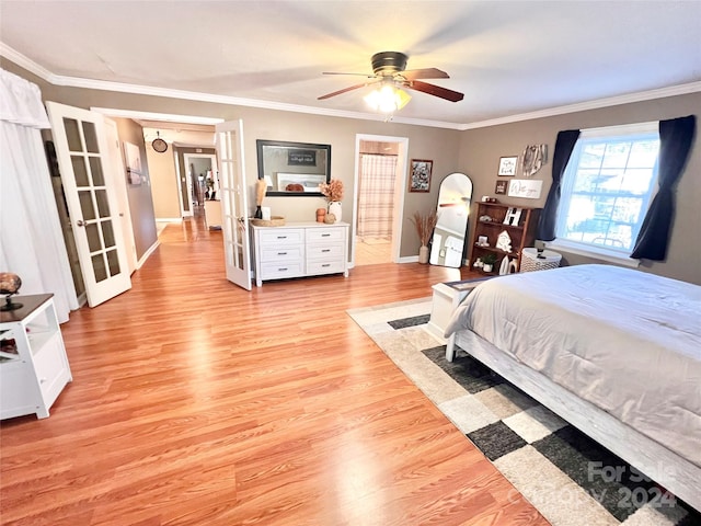 bedroom featuring ceiling fan, french doors, crown molding, and light hardwood / wood-style flooring