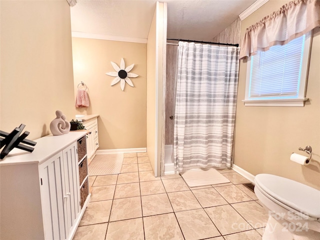 bathroom featuring walk in shower, vanity, crown molding, tile patterned flooring, and toilet