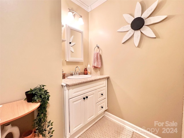 bathroom with tile patterned floors, vanity, and ornamental molding