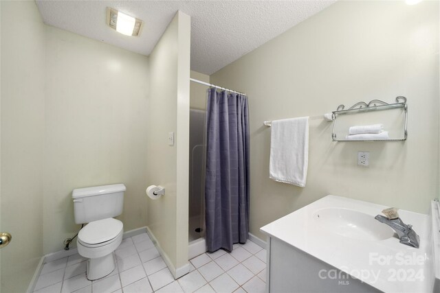 267 Rocky Mountain Way, Arden, NC 28704 - full bathroom featuring toilet, a stall shower, baseboards, tile patterned flooring, and a textured ceiling
