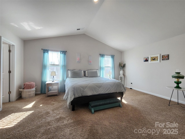 carpeted bedroom featuring lofted ceiling