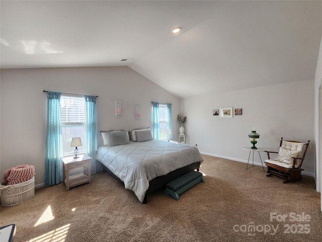 bedroom with vaulted ceiling and carpet