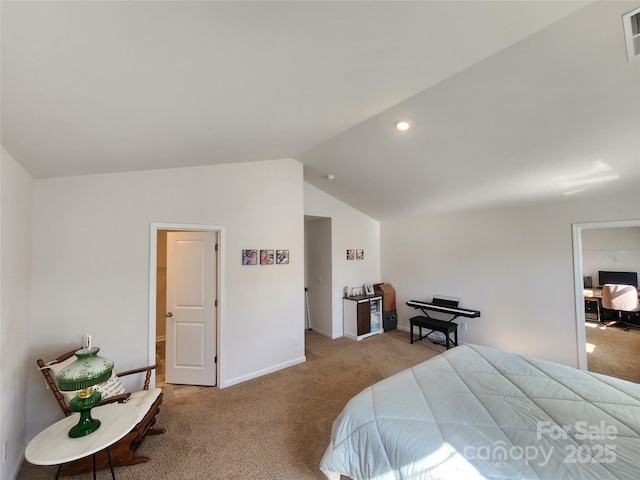 bedroom with light colored carpet and lofted ceiling