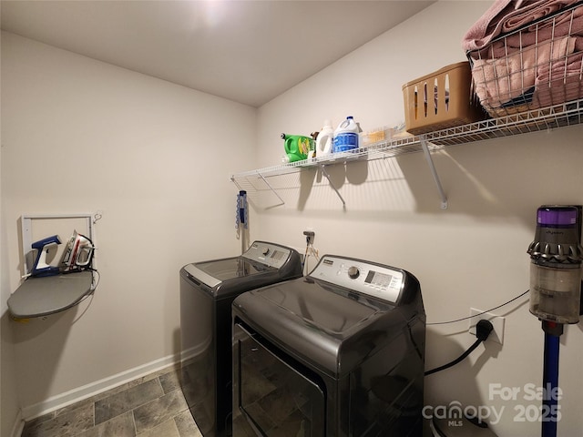 washroom featuring washer and clothes dryer