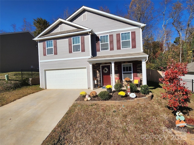 view of front of property featuring a porch and a garage