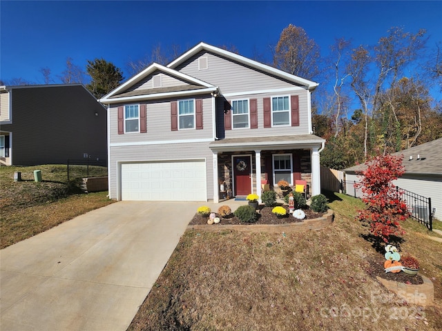 view of front facade with a front yard and a garage