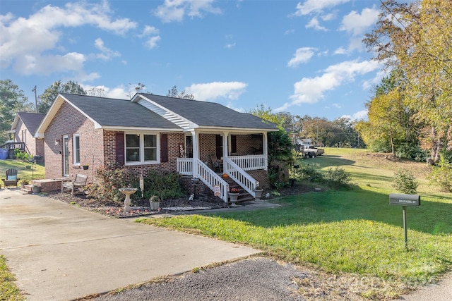 view of front of property with a front yard and covered porch