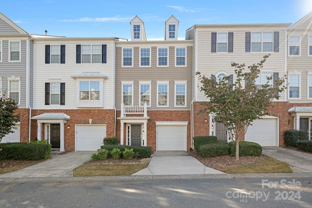 townhome / multi-family property featuring a garage