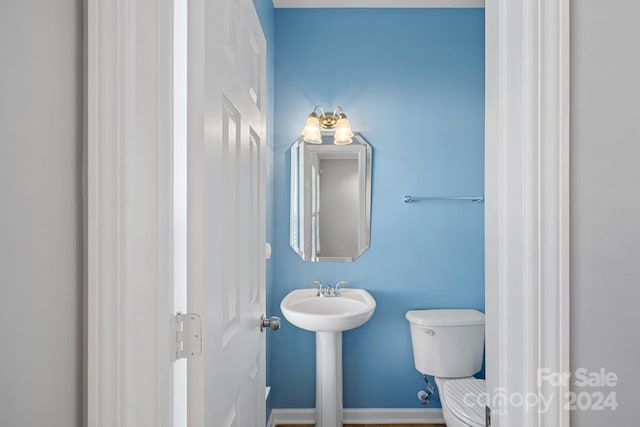 bathroom with sink and toilet