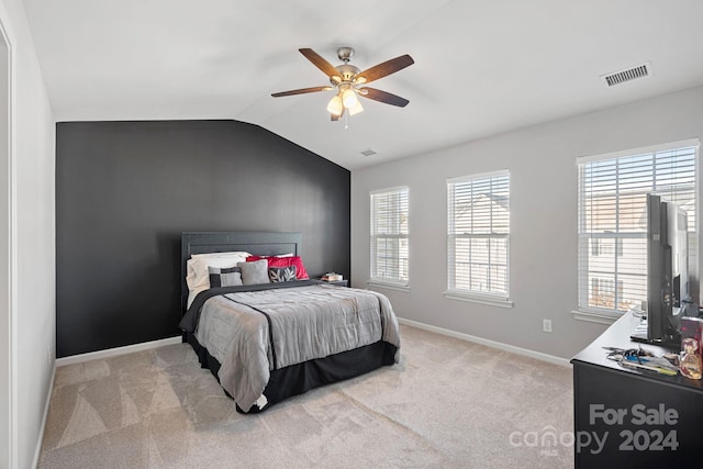 carpeted bedroom featuring ceiling fan and lofted ceiling