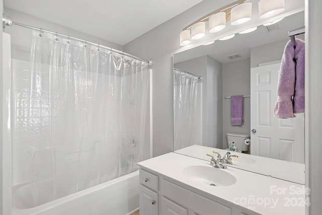 full bathroom featuring vanity, toilet, and shower / bathtub combination with curtain