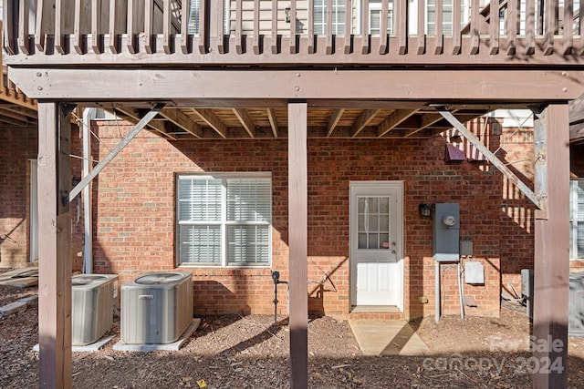 property entrance featuring central AC unit