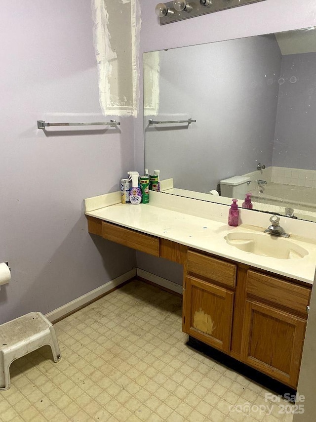 bathroom with vanity and toilet