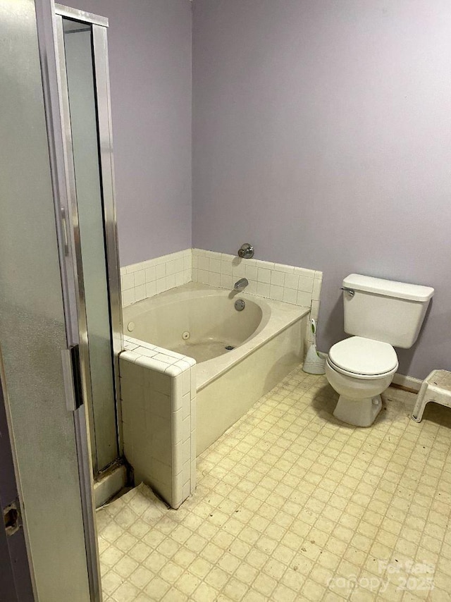 bathroom with toilet and a tub to relax in