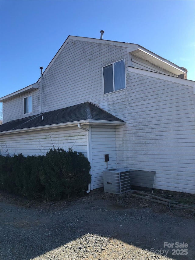 view of home's exterior with central air condition unit