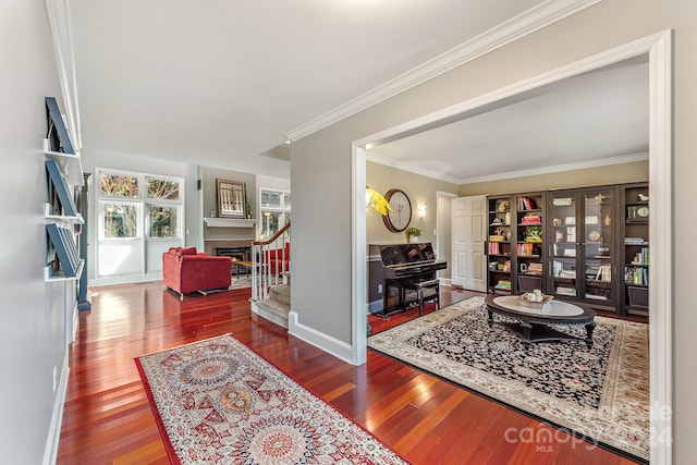 living room featuring hardwood / wood-style floors and crown molding