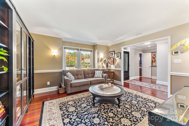 living room with ornamental molding and hardwood / wood-style floors