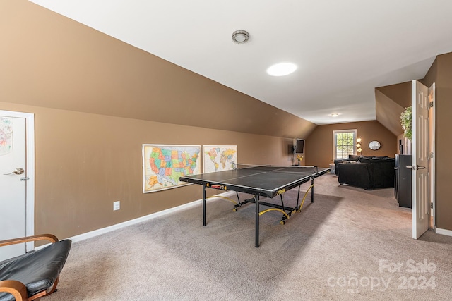 rec room with lofted ceiling and light colored carpet