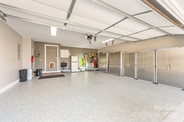 garage with a garage door opener, white fridge, and electric panel