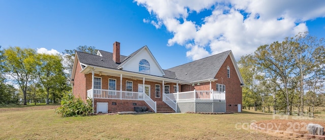 view of front of house with a porch and a front yard