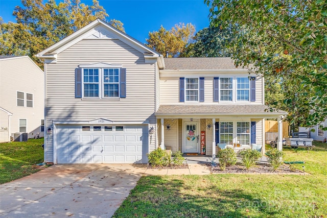 view of property featuring a front yard, central AC, covered porch, and a garage