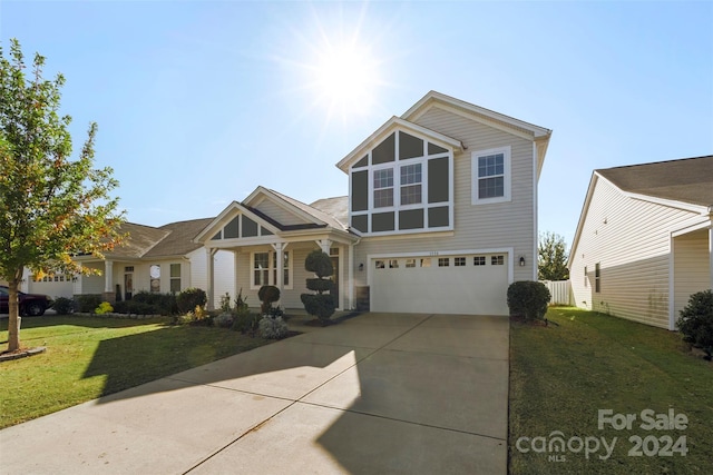 view of front of house with a front lawn and a garage