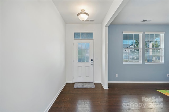 entrance foyer with dark hardwood / wood-style floors